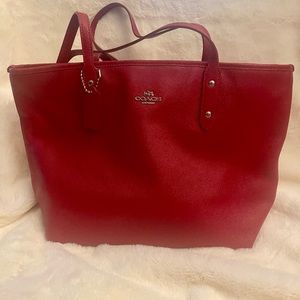 Red Coach over the should bag.